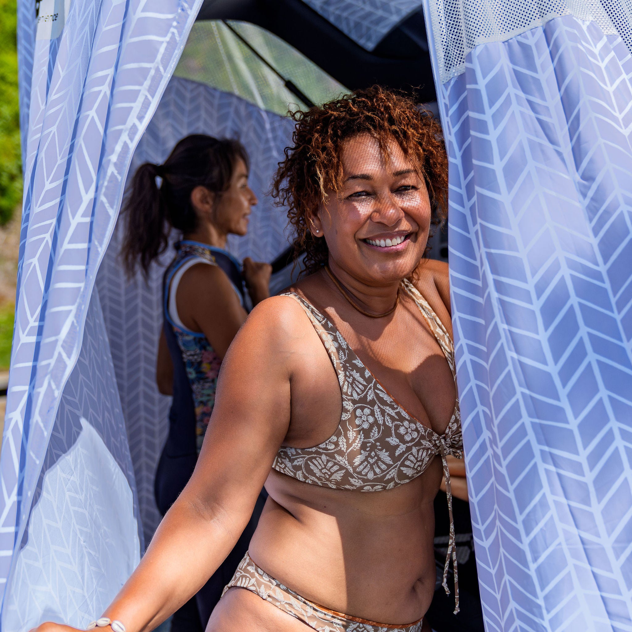 two ladies inside tent