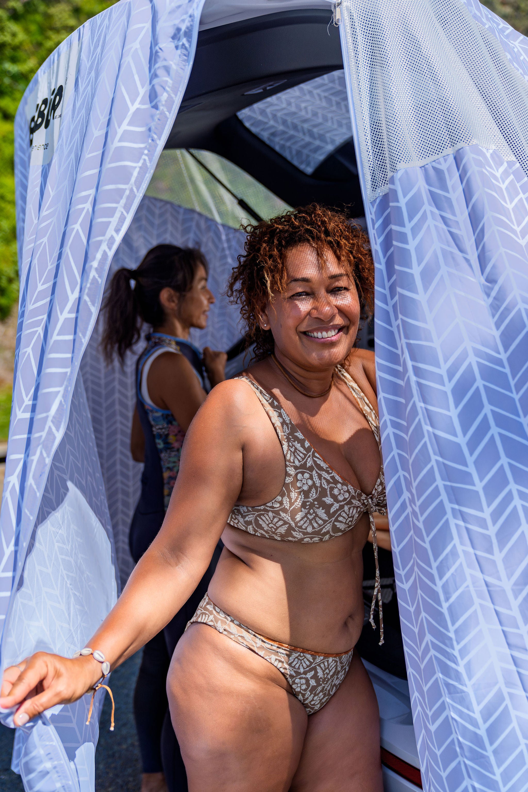 two ladies inside tent